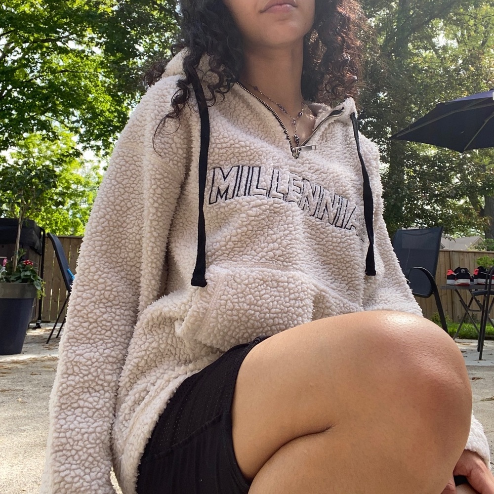 White millennial sweater